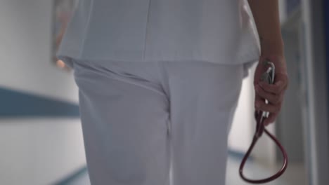 doctor walking in hospital corridor