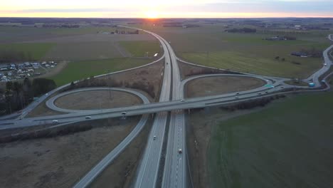 aerial view of freeway intersection with moving traffic cars