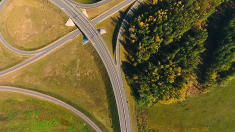 road intersection. aerial view of cars moving on highway road junction