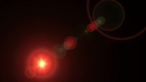 el destello realista de la lente de luz sobre un fondo negro.
