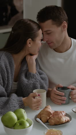 couple sharing a breakfast and expressing love.