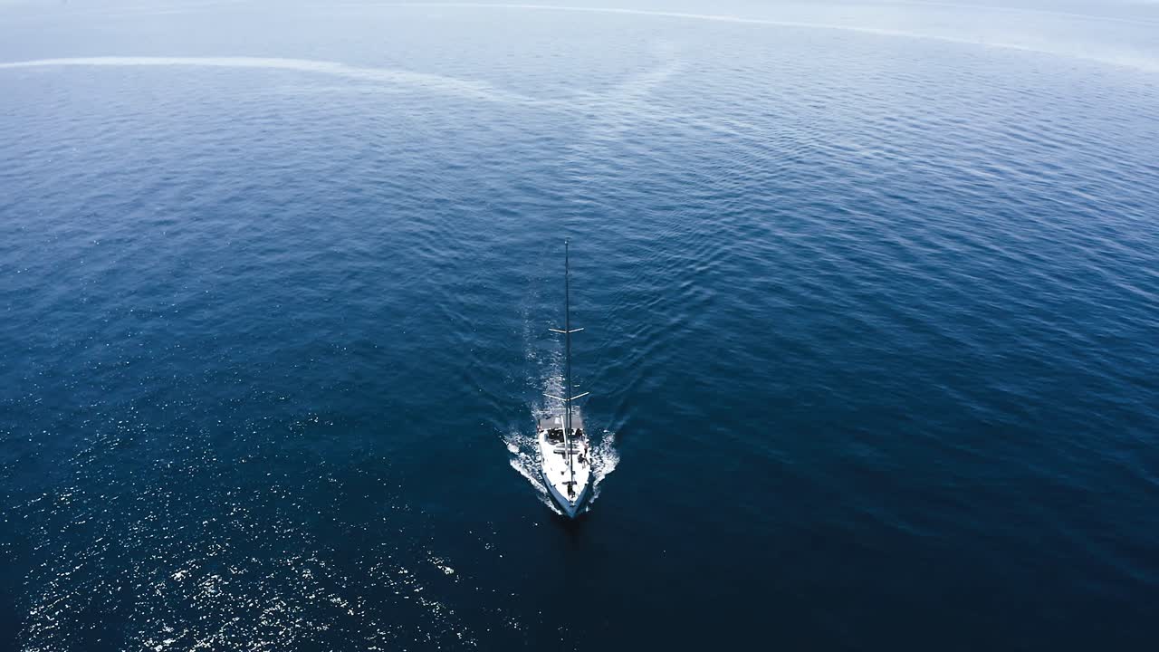 Boat on the sea, drone footage taken right above boat.