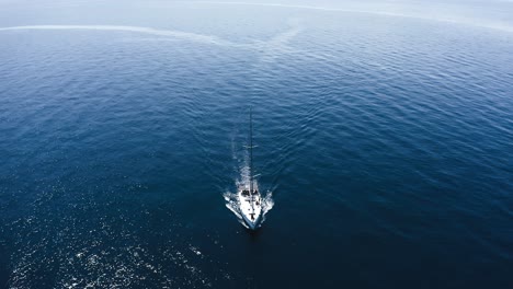 boat on the sea, drone footage taken right above boat.