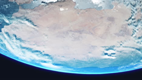 sahara desert africa from space with earth slowly rotating with view from orbit with dynamic clouds sea and atmosphere