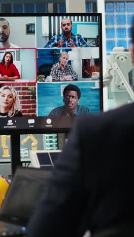 vertical video factory researchers doing internet videocall, working on breakthroughs
