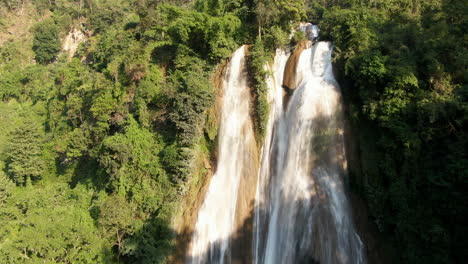 Water-stream-pouring-down-the-Dat-Taw-Gyaint-Waterfall-on-a-sunny-day