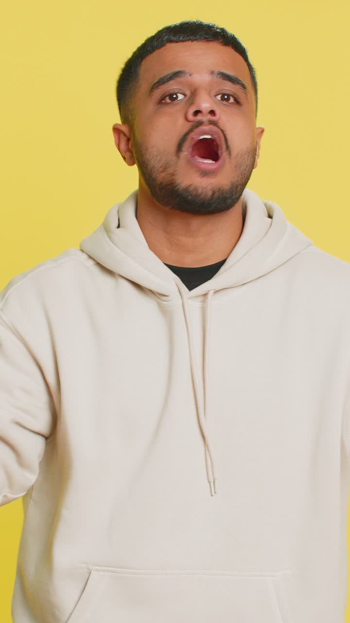 Confused indian man pointing at camera showing stupid asking for insane crazy bad plan bullying