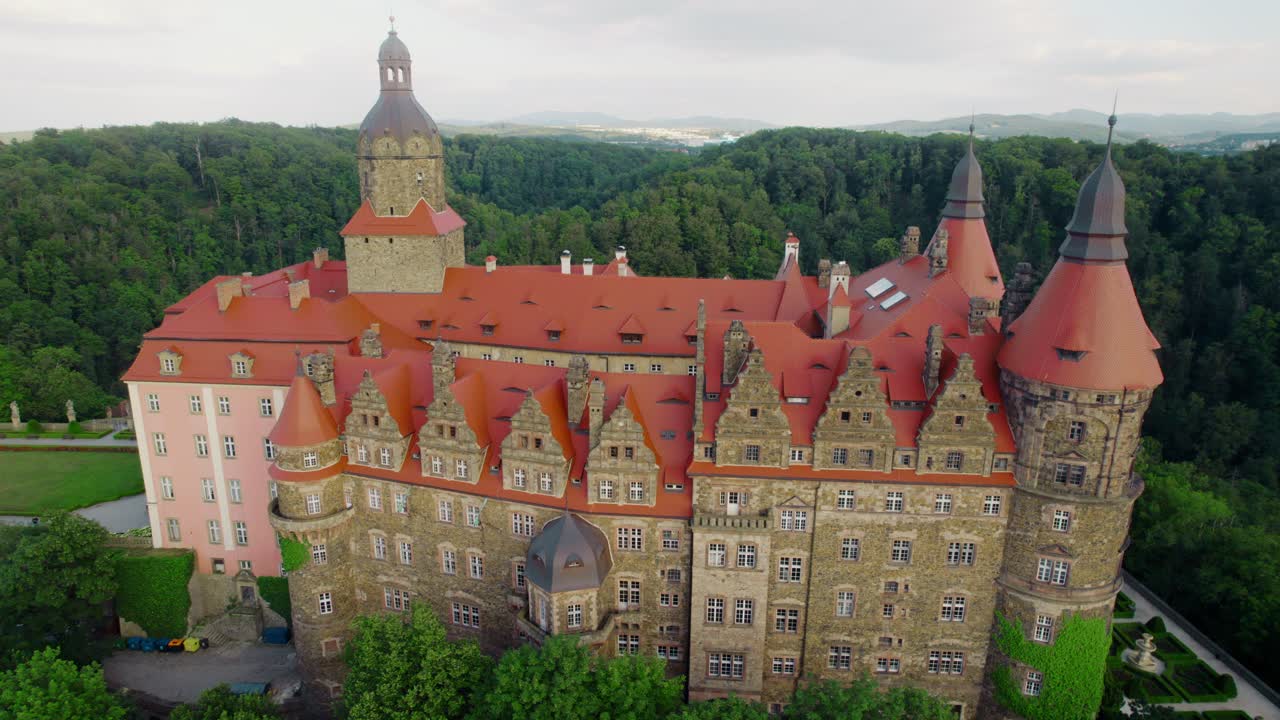 Aerial View of a Majestic Castle in a Lush Forest