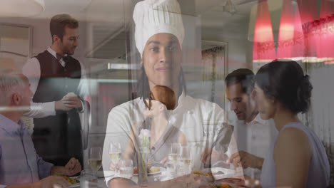 Animation-of-female-chef-over-people-at-table-in-restaurant