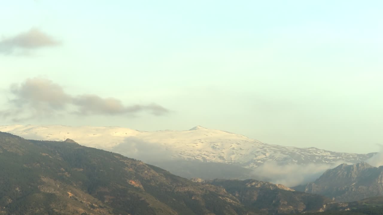 TIME LAPSE SHOT OF SIERRA NEVADA FROM GRANADA, SPAIN AT SUNSET