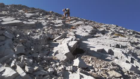 hiker ascending scrambling climbing approached kananaskis alberta canada