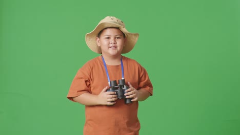 boy with binoculars and explorer hat