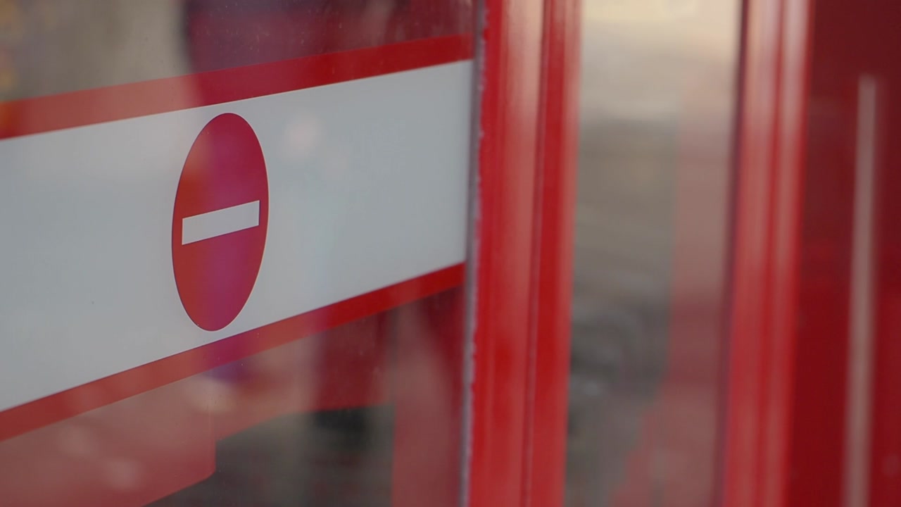 Red No Entry Sign on a Glass Door