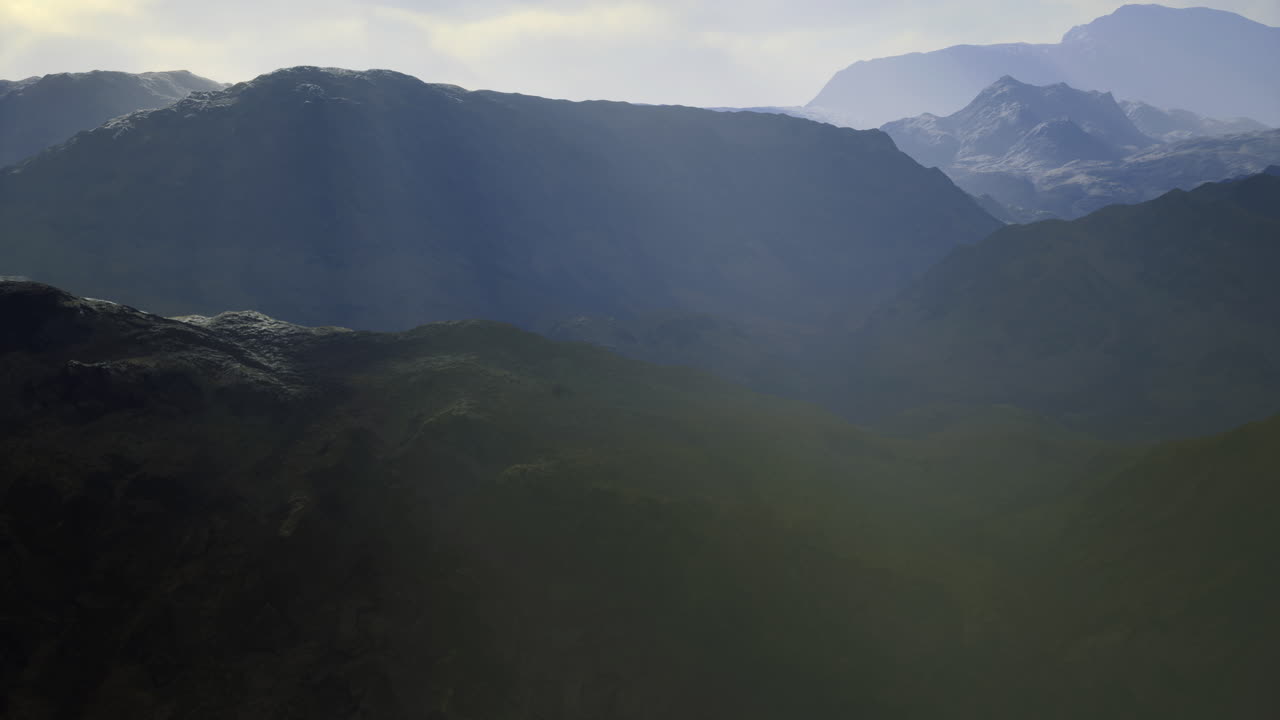 Majestic mountain range bathed in soft morning light showcases natures beauty