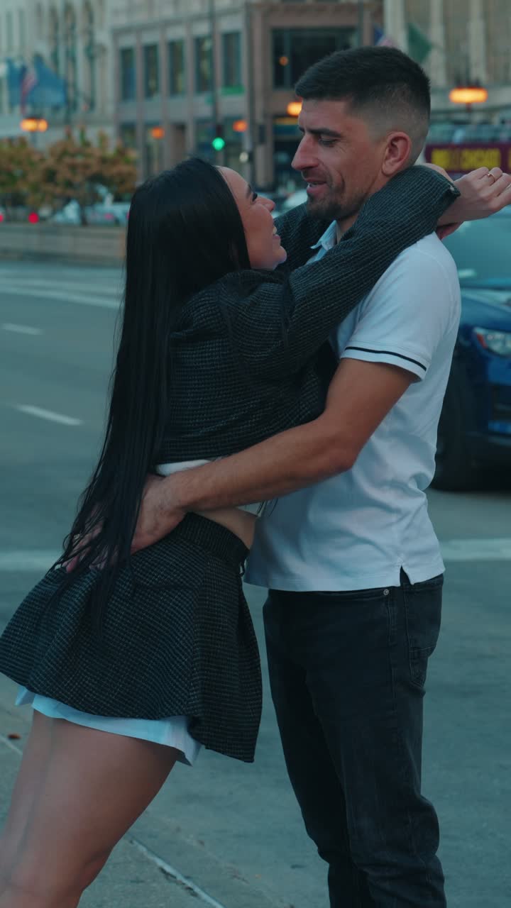 Romantic Commintment of Woman and Male Embrace on Busy Street in Downtown Chicago at Dusk