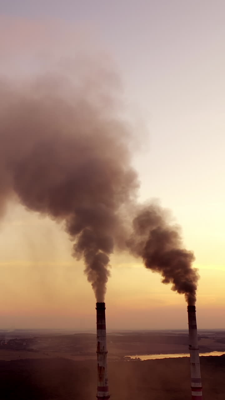 Smoke discharged by industry polluting. Air pollution and climate change theme Vertical video