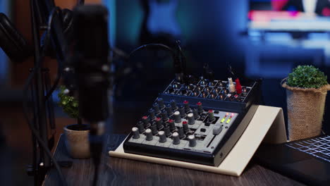 close up shot of analog mixer and microphone used to produce impeccable sound quality