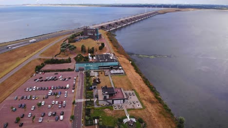 Drone-circling-and-revealing-the-beautiful-Haringvlietdam-and-windmills-in-service-of-Dutch-village-Stellendam-alongside-harbor