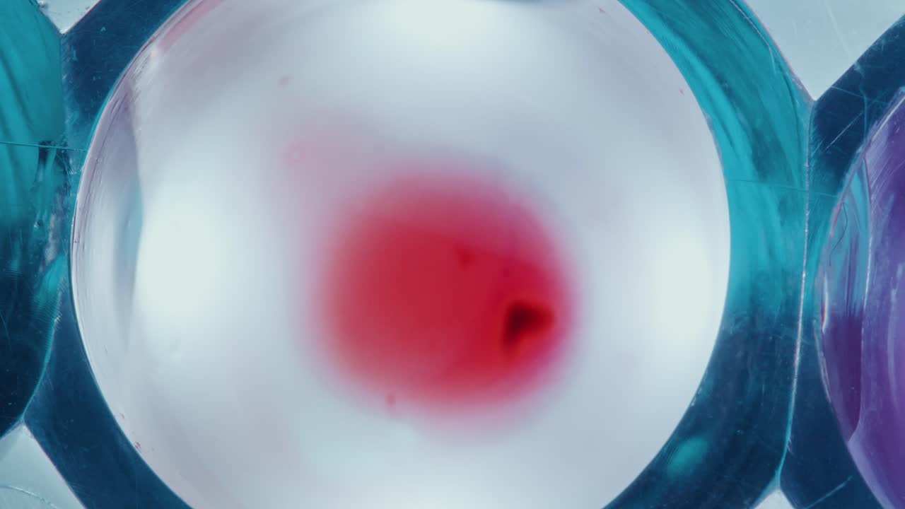 Withdrawing Blood with Pipette from Transparent Liquid in Test Tube