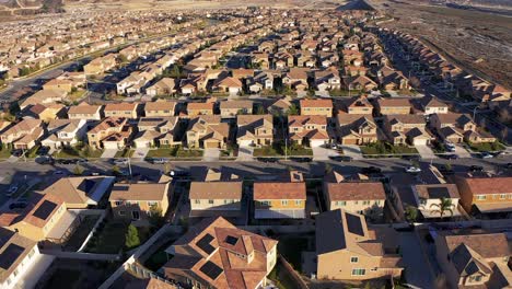 Aerial-pull-back-and-tilting-up-shot-of-a-master-planned-development-in-the-desert