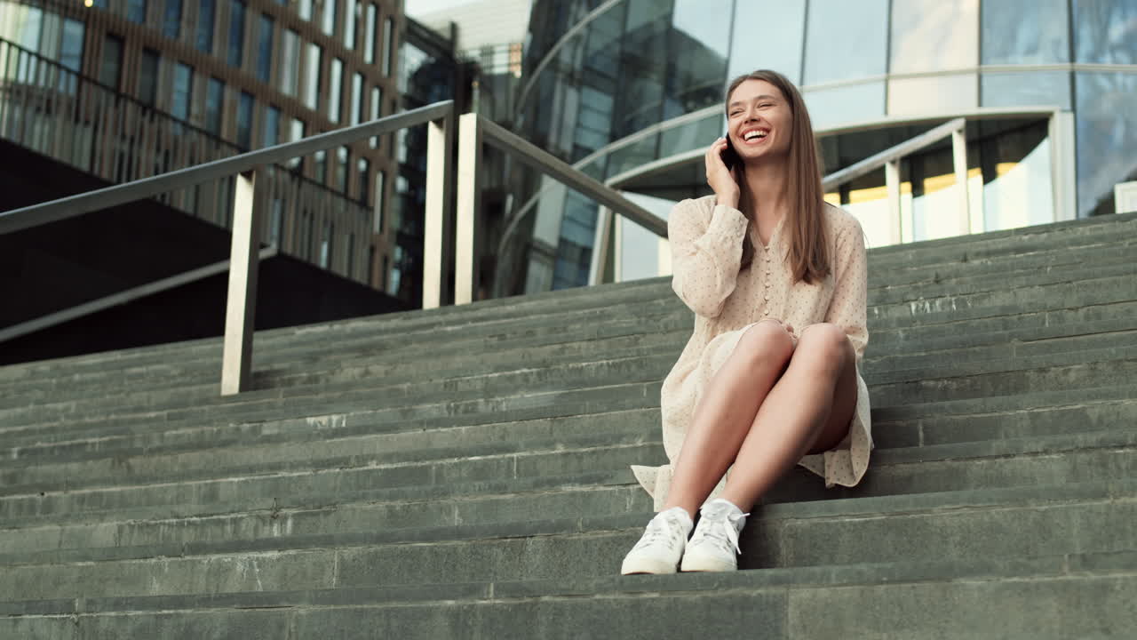 Sitting on Stairs Talking on Phone
