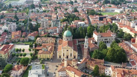 aerial view of the city of thiene in veneto with mountain in the backgound