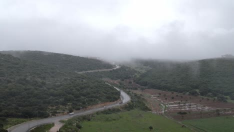 Aerial-view-of-misty-forest-at-Israel,-Katzir