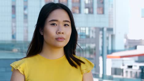 asian business lady smiling at camera outdoors