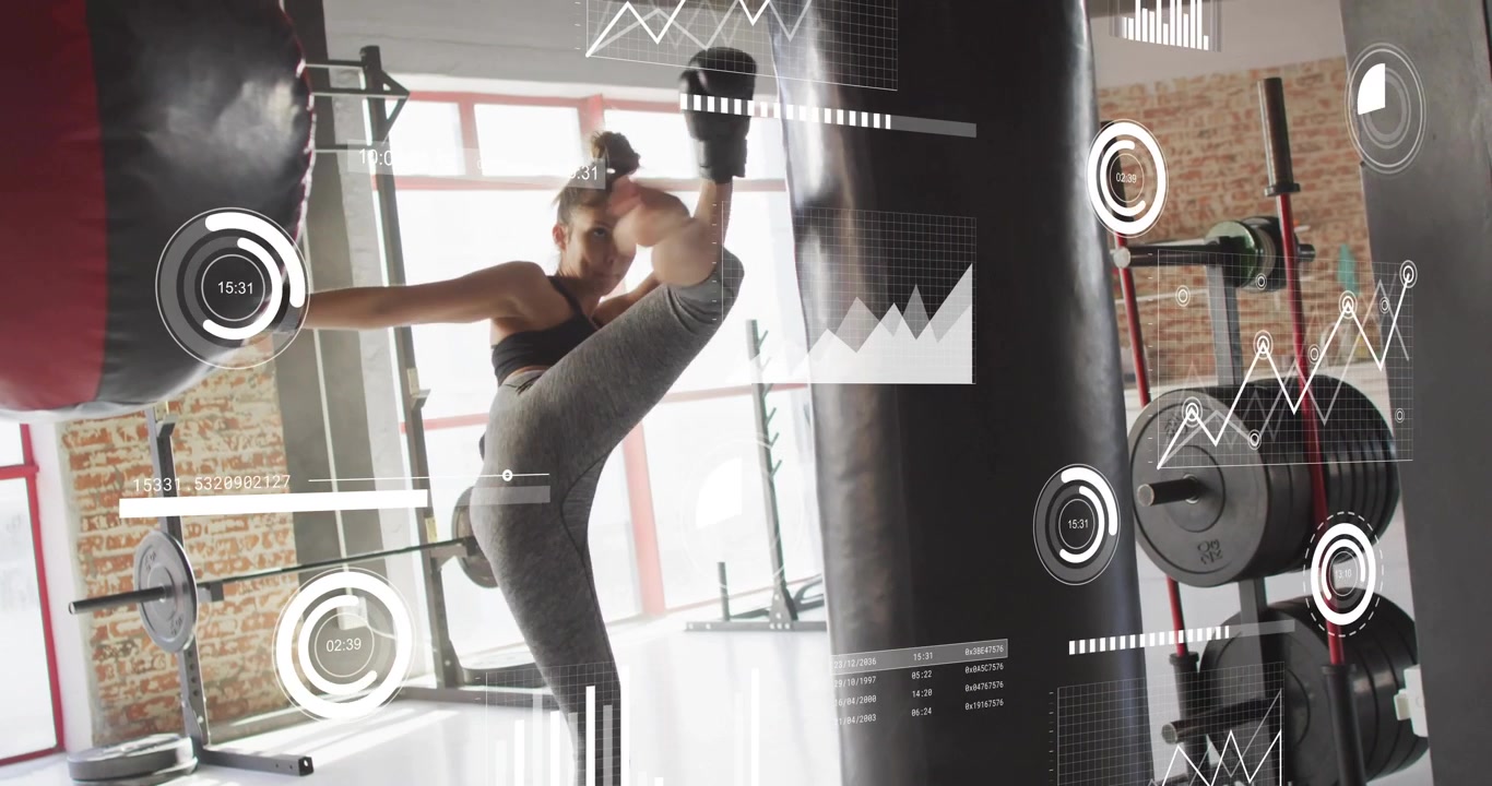 Throwing combos woman wearing sportswear striking heavy bag at gym with boxing gloves HUD overlays