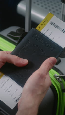 holding passport and boarding pass