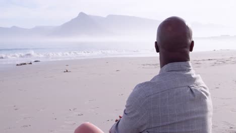 Mature-man-enjoying-time-outside-by-the-sea