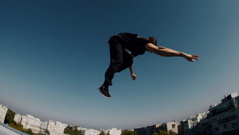man performing parkour on city rooftops