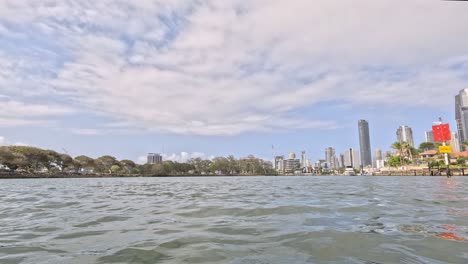 progressive view of a city skyline from a boat