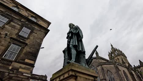 crowds gather around adam smith statue in edinburgh