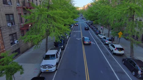 aerial of people banging pots and pans honking and clapping thanking nurses and doctors on new york streets during coronavirus pandemic 1