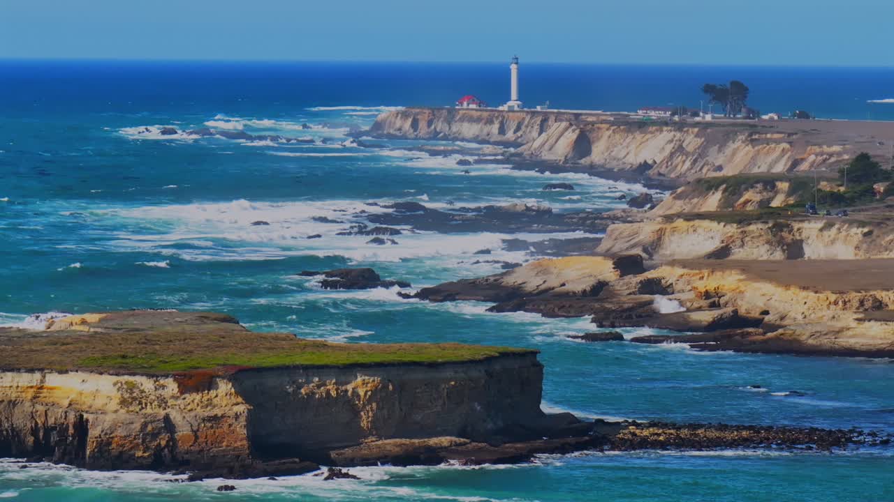 Lighthouse on a dramatic cliff overlooking the Pacific Ocean