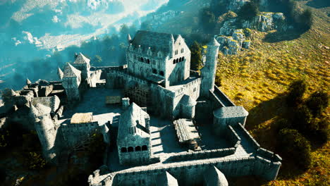 aerial view of a majestic, abandoned medieval castle in a mountainous landscape