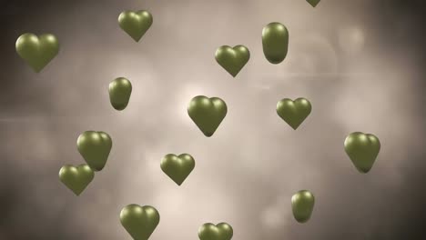 Animation-of-gold-hearts-over-light-spots-and-smoke