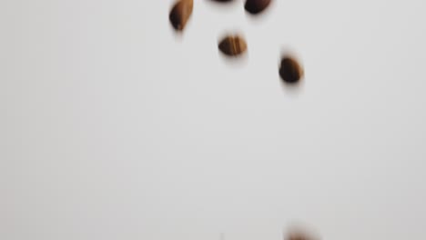 Dumping-out-a-bag-of-coffee-beans-across-the-screen