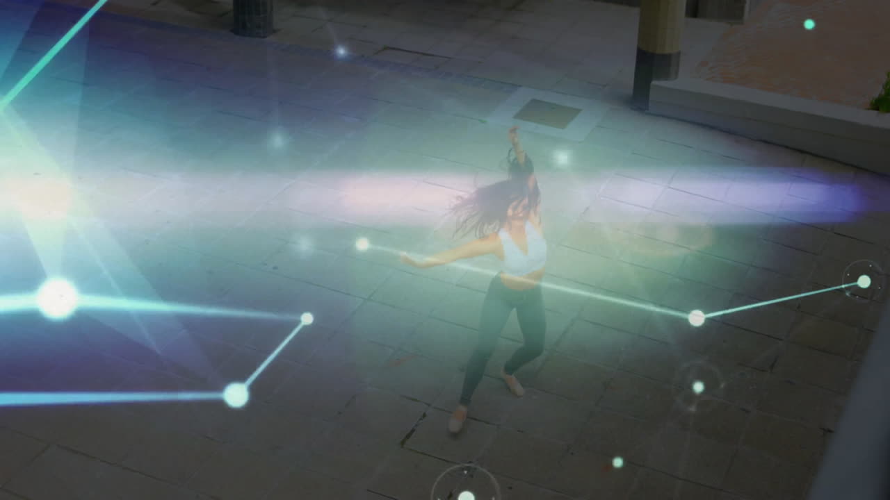 woman spinning on plaza at night, showing animated holographic streaks for technology presentation