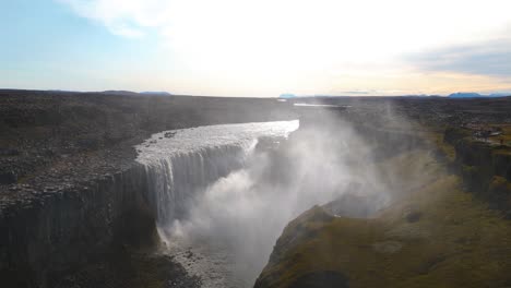 immense power of icelandic dettifoss waterfall captured in aerial arc shot