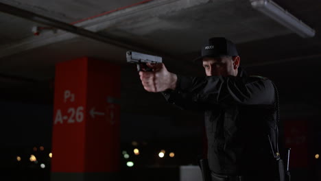 Police-officer-preparing-for-shoot-with-gun.-Focused-cop-aiming-firearm