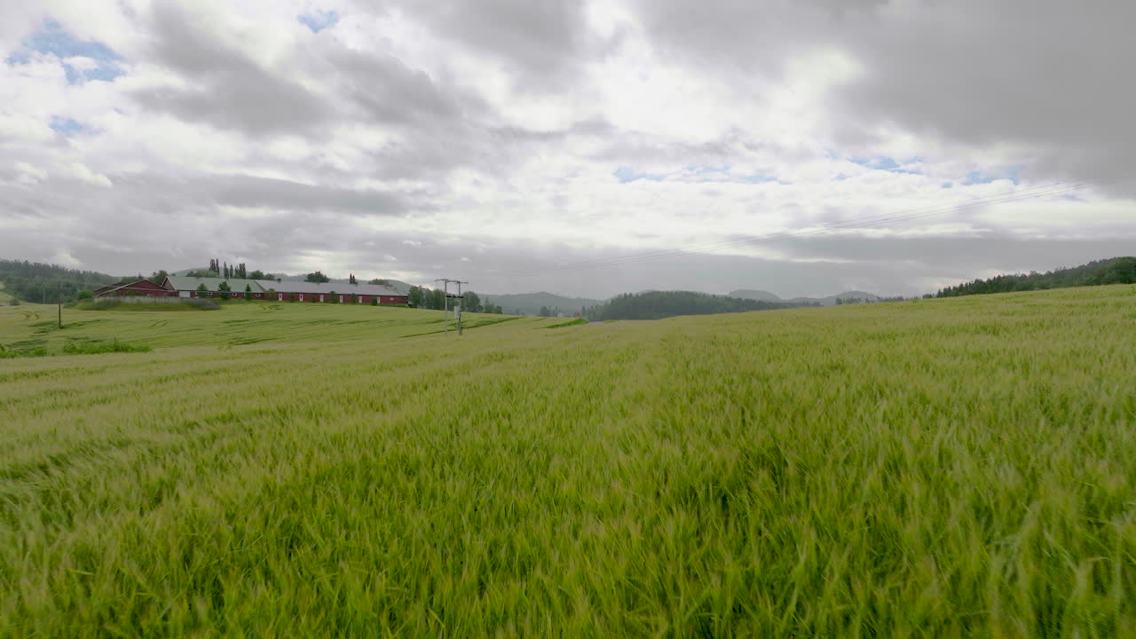 Drone shot of farmland and fields in Norway