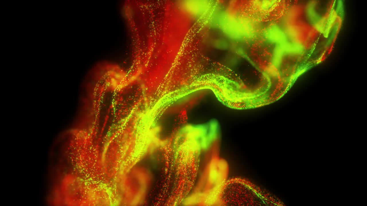 A dynamic burst of shimmering particles disperses, creating an energetic, glowing visual with vibrant movement and fading trails.