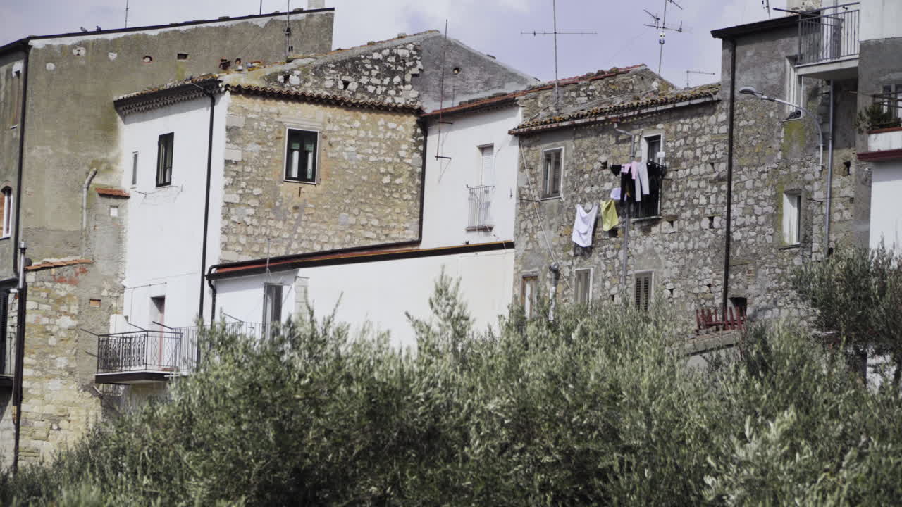 Rear Exterior Facade Of Residential Buildings In Italy On A Sunny Day - medium shot