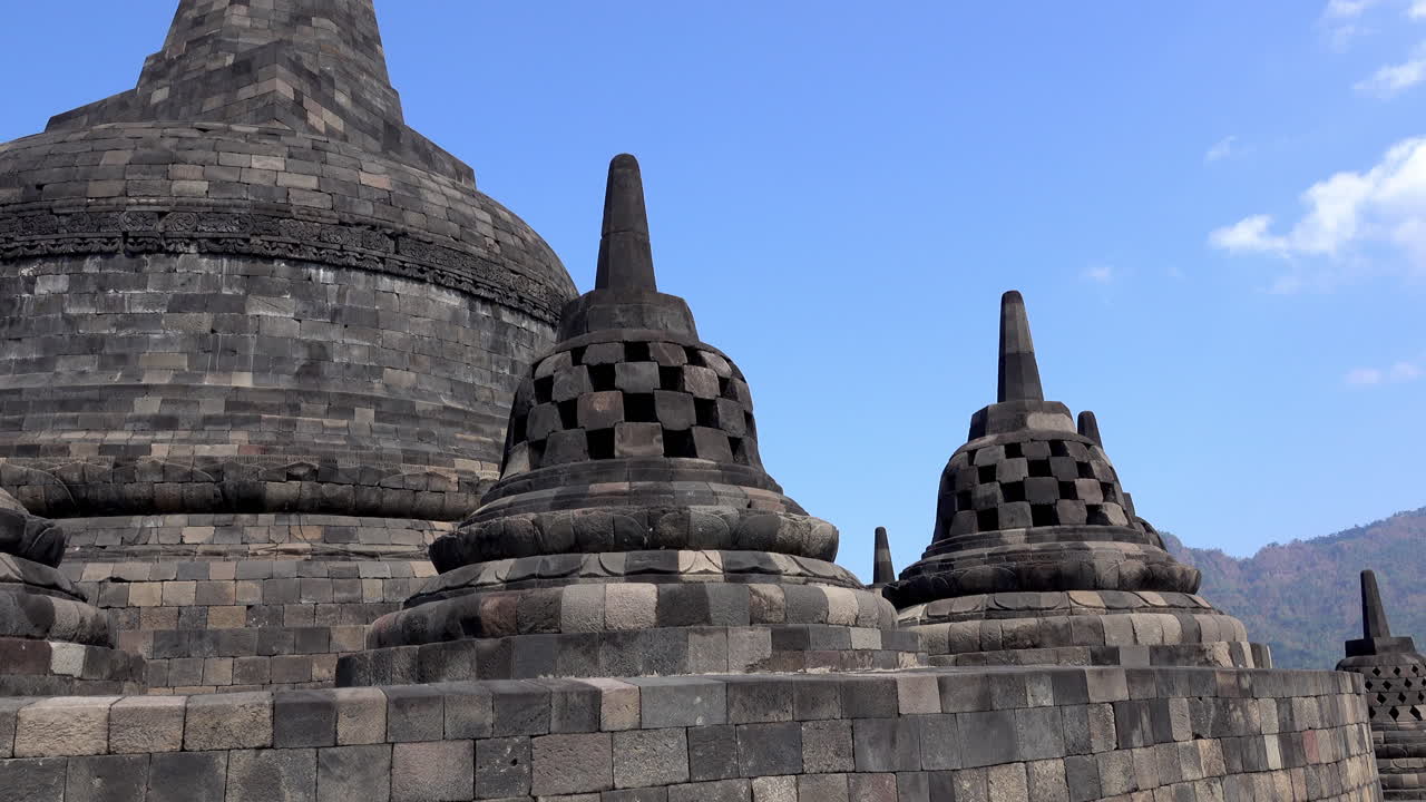 Stupas at the peak of Borobudur Temple in Indonesia.