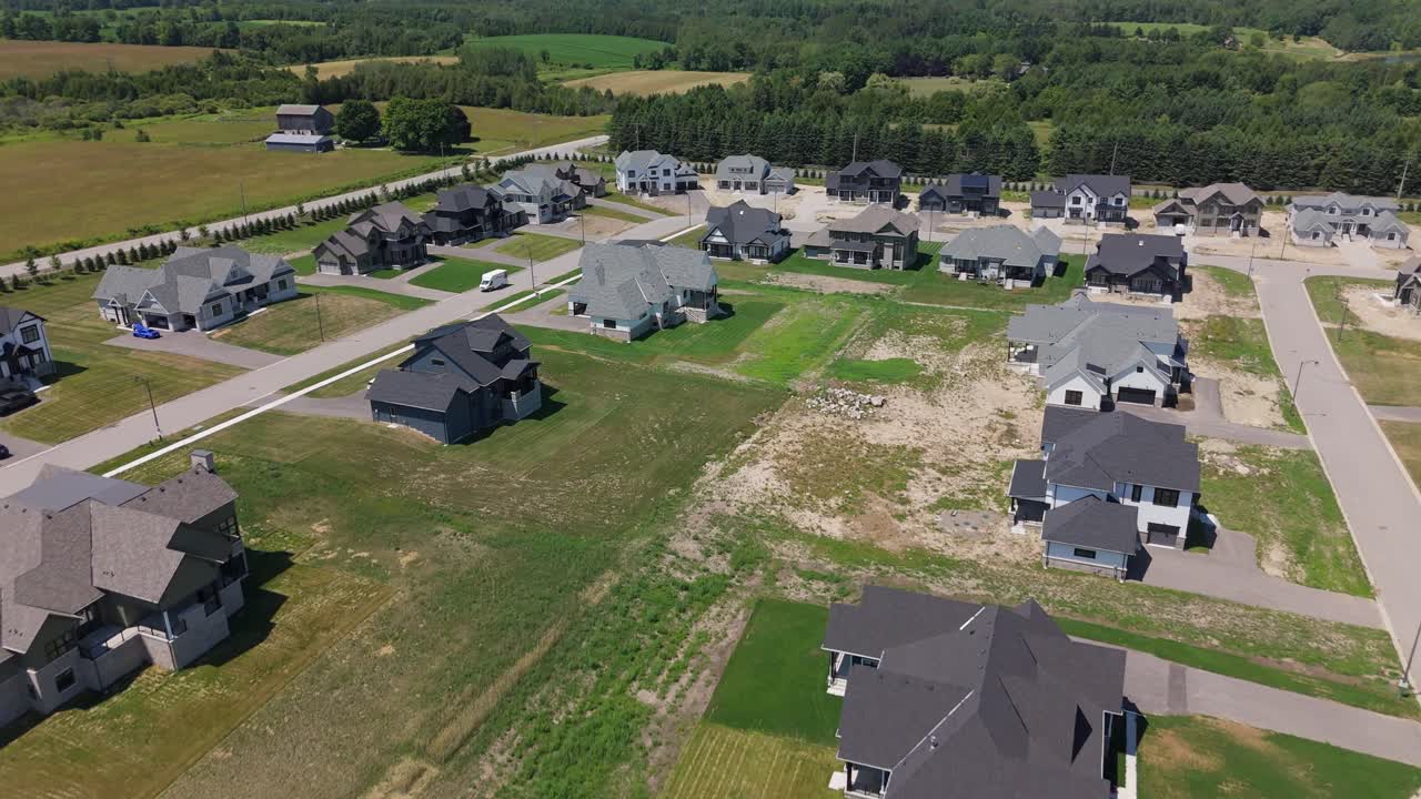 New suburban housing development aerial establishing in Caledon, Ontario, Canada, aerial pullback