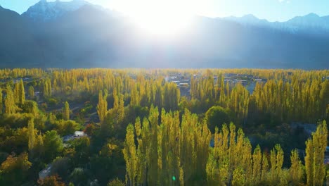 Aerial-shot-of-sun-shining-over-mountains-at-Skardu-Valley-during-spring-in-Pakistan