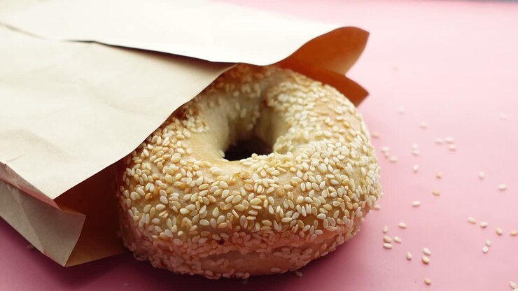 Sesame Bagel in a Brown Paper Bag