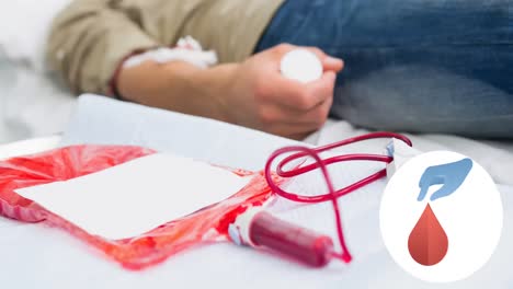 animation of blue hand and blood drop logo, over male donor lying down and giving blood